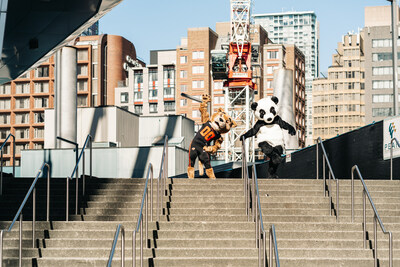 WWF's panda mascot and BC Lions' mascot 'Leo the Lion' take the stairs at Terry Fox Plaza outside of BC Place - the Vancouver location of WWF's Climb for Nature. The stair climb will take see participants go up and down the stadium's lower bowl on May 26. (c) Garret Corson/WWF-Canada (CNW Group/World Wildlife Fund Canada)
