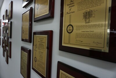 Patents showcased in the hallway of Wildcat Discovery Technologies.