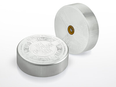 The Swiss ice hockey puck called "Eisgenoss", which is issued in a limited edition of gold, silver and conventional hard rubber, gives fans access to unique privileges thanks to an integrated chip. (PRNewsfoto/philoro)