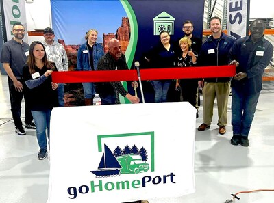 Surrounded by goHomePort staff and President Mike Douglas: Dean Tarantino, Director of Colorado Operations for goHomePort RV Service and Repairs, cuts the ribbon for the official grand opening of goHomePort RV Service and Repairs in Colorado Springs on April 19, 2024.