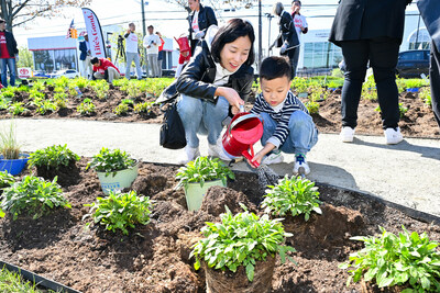 Attendees plant native species at the new pollinator garden at Life's Good Earth Day Community Fair, Monday, April 22, 2024, at the LG Electronics North American Innovation Campus in Englewood Cliffs, NJ. Earning a Certified Wildlife Habitat® certification through the NWF, LG's garden is outfitted with native plants, designed to attract a mixture of pollinators, such as bees, butterflies, moths, and beetles, which will encourage biodiversity, plant growth, clean air, and support wildlife. (Diane Bondareff/AP Images for LG Electronics)