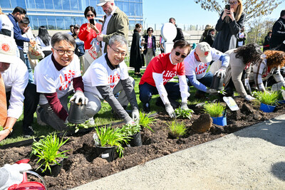 Chris Jung, center left, President and CEO of LG Electronics North America, and Mayor Mark Park, center right, of Englewood Cliffs, plant native species at the new pollinator garden at Life's Good Earth Day Community Fair, Monday, April 22, 2024, at the LG Electronics North American Innovation Campus in Englewood Cliffs, NJ. The event hosted a range of activities that highlighted the importance of sustainable practices including the unveiling of the pollinator garden which earned a Certified Wildlife Habitat® certification from National Wildlife Federation. (Diane Bondareff/AP Images for LG Electronics)