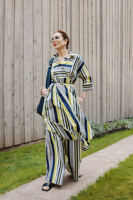 Carla Rockmore in her new Spotlight on Summer, Stripe Collection. Carla is wearing the Stripe Shirt Dress, the Stripe Palazzo Pant, and the Sling Bag 2.0 in Navy.