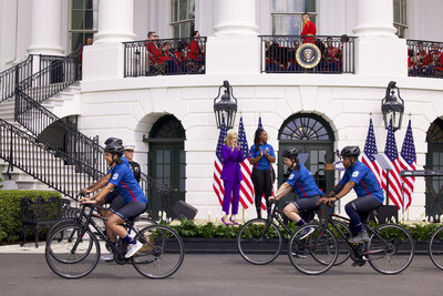 First Lady Dr. Jill Biden and Navy Veteran Sharona Young cheer on participants of Wounded Warrior Project's Soldier Ride at the White House. Dr. Biden welcomed and honored over 25 warriors, their family members, and caregivers alongside the American public for the annual event in the nation's capital.