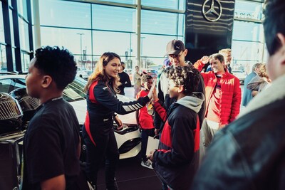 Canadian race-car driver, Demi Chalkias, engages with young people from Big Brothers Big Sisters at “Driving Your Future at Mercedes-Benz Toronto Queensway”. The event was an extension of Mercedes-Benz’s national partnership with Big Brothers Big Sisters of Canada and was hosted to inaugurate a new state-of-the-art new facility at 1631 The Queensway, which features the first AMG Brand Centre in North America. (CNW Group/Mercedes-Benz Canada Inc.)