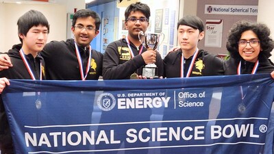 Aldric Benalan (center) with the Science Bowl Championship trophy.