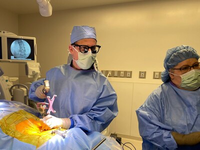 Dr. Dru prepares the implant trajectory through a tiny incision.