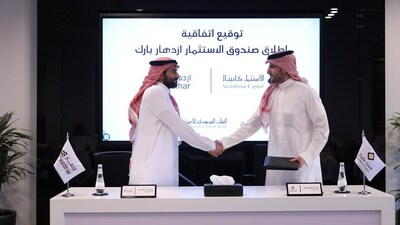 Mr. AbdulMohsen bin Fawaz AlHokair, CEO of Ezdihar Real Estate Development Company, and Mr. Khaled bin Abdulaziz AlRayes, CEO of Alistithmar Capital, celebrate the signing of a landmark 1.1 billion Riyal real estate fund in Riyadh, promising to reshape the city's commercial landscape.