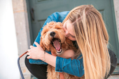 Photo courtesy of Shutterstock (woman hugging dog)