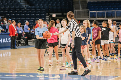 At the Elks Hoop Shoot National Finals, competitors in the 10-11 Girls division line up to take practice shots at the Wintrust Arena in Chicago.