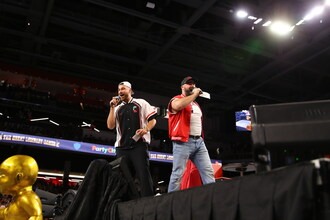 The Kelce brothers address the crowd at the Great Lombaby Games [Credits: Photographed by Steven Distel; image provided by Cincinnati Athletics].