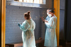 CIP Berkeley students performing touch up painting at a local non-profit.