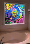 Decorating a tub window with AI generated art.