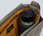 Water bottle pocket holds up to a 3-inch diameter water bottle and retracts when not in use.