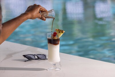 The Caribbean Cocktail Critic will influence the flavor profile, looks, and taste of Sandals Resorts’ new poolside cocktails, including a classic Piña Colada elevated with a house-made Blue Mountain coffee liquor floater.