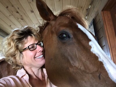 Susan Kayne with Possession, a thoroughbred mare rescued for $200 on her way to a slaughter auction. As a yearling, Possession sold for $2,000,000.