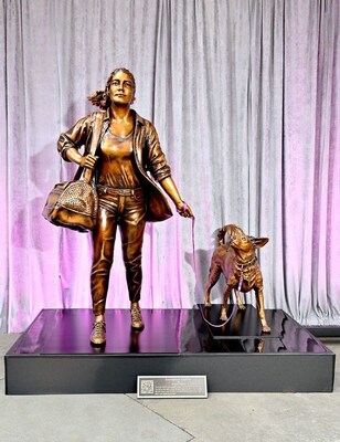 “Courageous Together” by Kristen Visbal was commissioned as part of the Purple Leash Project, an initiative led by Purina and the nonprofit, RedRover, that aims to help more domestic violence shelters become pet-friendly.