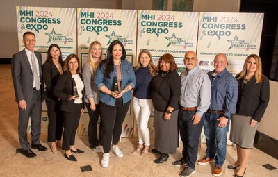 MHI's Land-Lease Community of the Year Award for the East is presented by MHI President Mark Bowersox (far left) and MHI CEO Lesli Gooch (far right) to representatives of Village Green at the 2024 MHI Congress & Expo in Las Vegas.
--Photo courtesy of Manufactured Housing Institute--