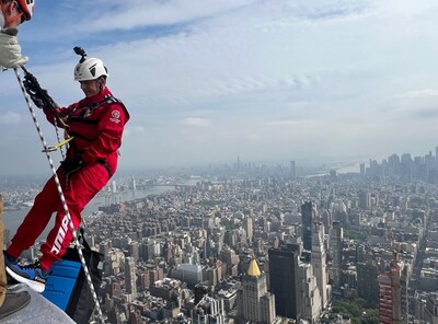 Darren Richman, member of the Outward Bound USA Board of Directors, rappels off the Empire State Building in New York City.