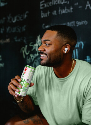 Man drinking new can of FITAID RX Zero, can showcases Juicy Apple flavor with bold flavor call outs and list of clean ingredients. FITAID, the fitness recovery original, founded in Santa Cruz in 2011, has been a mainstay of gym routines around the globe for simplified recovery. FITAID is a collection of clean fitness drinks that are always naturally sweetened, have clean caffeine, and use the highest quality vitamin blends.