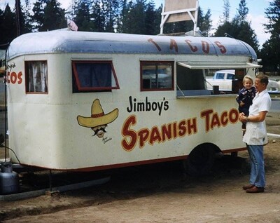 Founder Jim “Jimboy” Knudson poses with the original Jimboy’s trailer in the restaurant’s birthplace, Lake Tahoe, CA.