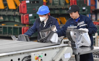 Staff members work at the factory of Bosa in Peng'an, Sichuan province