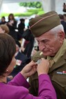 Trippon receiving medal.