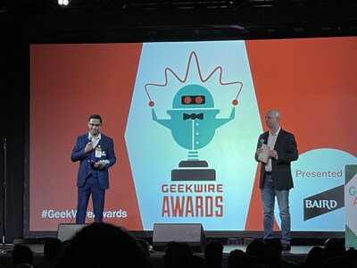 Zuper accepts the award.