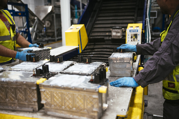 American Battery Technology Company employees load lithium-ion batteries for processing at its recycling plant in Nevada.  The company is making significant advancements in commercializing its internally-developed, first-of-kind, battery recycling technologies for recovery of battery materials with high yields, low cost, and a low environmental footprint.