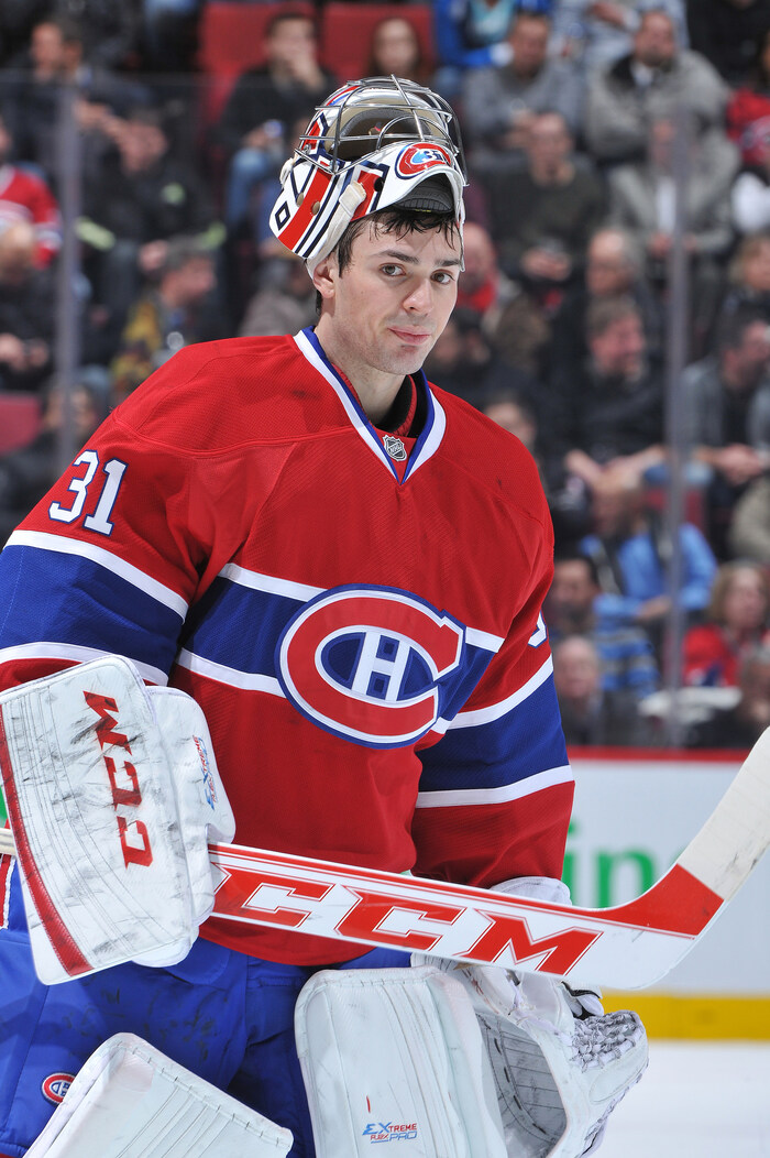 Carey Price, wearing a red Montreal Canadiens jersey, with his helmet up during a break in the action during a game against the Florida Panthers in 2013. He will receive an honorary degree from the University of Northern British Columbia on May 31.
Photo credit: François Lacasse / Club de hockey Canadien Inc. (CNW Group/University of Northern British Columbia)