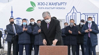 Kazakhstan's President Tokayev placing a commemorative capsule during the launching ceremony of the upgrade of Almaty CHP Plant 2.