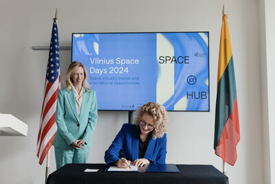 Aušrinė Armonaitė, Lithuanian Minister of Economy and Innovation, signs the Artemis Accords in the presence of United States Ambassador Kara C. McDonald at a ceremony in conjunction with Vilnius Space Days.