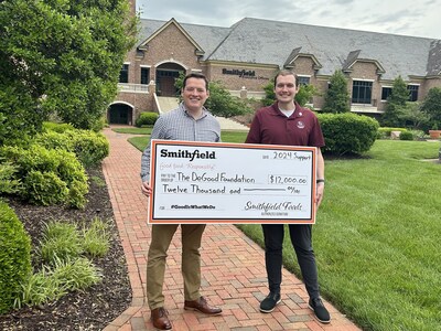Left to right: Jonathan Toms, senior community development manager, Smithfield Foods, presents a $12,000 check to Kyle DeGood, founder and executive director, The DeGood Foundation, to expand early childhood literacy access in Isle of Wight County, Virginia.