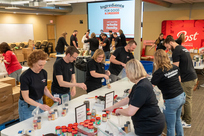 Employees at Post Consumer Brands volunteer to assemble culturally relevant meal packs during the company's 'Ingredients for Good' initiative on Tuesday, April 23, 2024 in Lakeville, Minn. (Craig Lassig/AP Images for Post Consumer Brands)