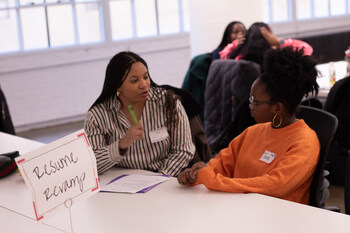 A professional provides resume guidance to a high school student at a Girls Inc. of NYC college and career event. Photo by Alanna Savage