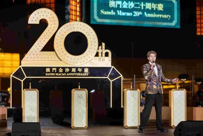 Local singer German Ku delivers an outstanding performance at the opening of Sands Macao's 20th anniversary celebration Thursday at the hotel and entertainment complex's outdoor fountain.