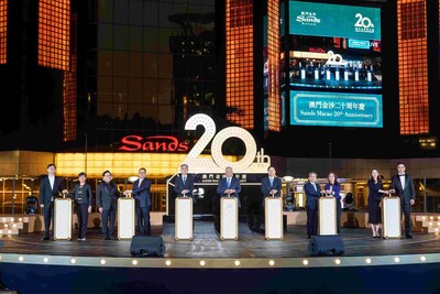 Guests of honour officiate the 20th anniversary celebration for Sands Macao Thursday at the hotel and entertainment complex's outdoor fountain.