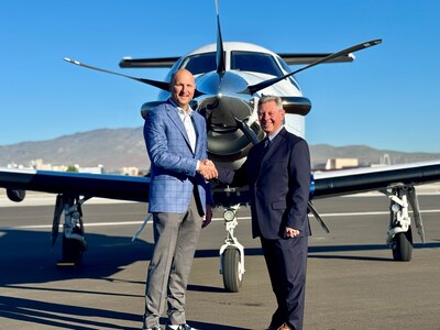 Ben Clayton, chief executive officer for Life Flight Network, and Barry Duplantis, president and chief executive officer of REMSA Health shake hands in front of the Pilatus PC-12 that Life Flight Network now operates on behalf of Care Flight.