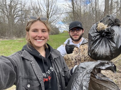 Everlight Solar staff members clean up the Menomonee River.