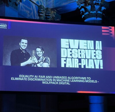Wolfpack Digital's co-CEOs, Georgina Lupu Florian and Adrian Florian, with the Webby Award and their 5-word speech.