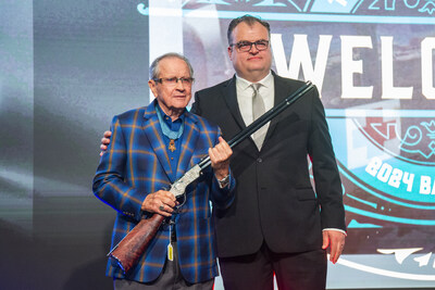 President of Henry Repeating Arms, Andrew Wickstrom (right), presents a New Original Henry Silver Deluxe Engraved rifle to retired U.S. Army Maj. Gen. Patrick Brady (left), America's most decorated living veteran in Dallas, Texas, at the NRA Foundation Banquet and Auction on May 16th, 2024. (NRA Publications/Peter Fountain)