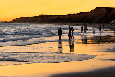 Visitors enjoying a beautiful sunset at Crystal Cove State Park. Photo from California State Parks.