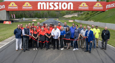 Sharing in the celebration are members of the Road America Staff, Sheboygan County Chamber Ambassadors and Sign Me Up of Wisconsin. Cutting the ribbon is Mission Foods Chief Executive Officer Juan Gonzalez.