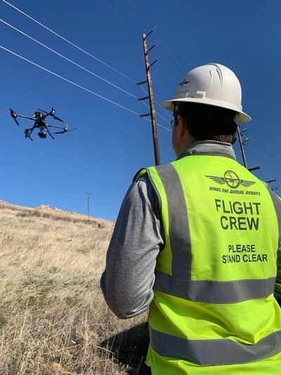 BEAD aerial drone pilot shown inspecting distribution power line. Power utilities are increasingly turning to drone inspection due to cost efficiencies, time savings, accuracy and improved safety.