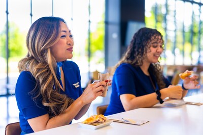 Alaska Airlines Flight Attendant Krystal G. enjoys our Monte Cristo Breakfast Sandwich made with smoked turkey breast, sliced ham and Swiss cheese on a square croissant bun with cream cheese & raspberry jam.