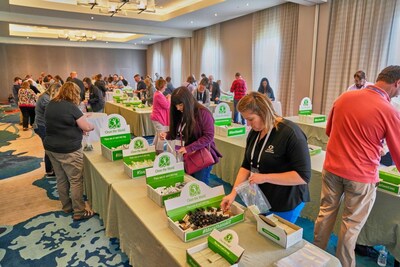 Ignite! attendees and Finastra team members assembling personal care packages during the event's closing activity.