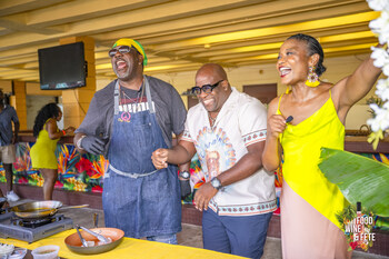 Food, Wine, and Fete 2024: Chef Irie, Teddyson John, and host Carla Hill at their cooking demo.