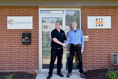 Justin Miller and Murray Freeman shake hands in front of CLEANLIFE®'s World Headquarters.
