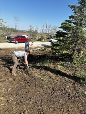 Everilght Solar’s Darius Flessner and Mason Stinson helping with the tree cleanup after the tornado in Omaha, Nebraska