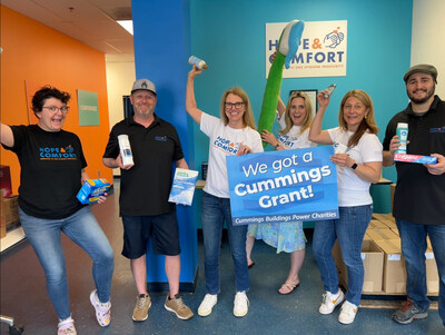 The Hope & Comfort team jumping for joy to celebrate the amazing news!